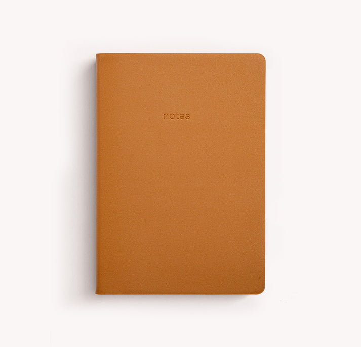 Brown notebook with the word 'notes' embossed on the cover.